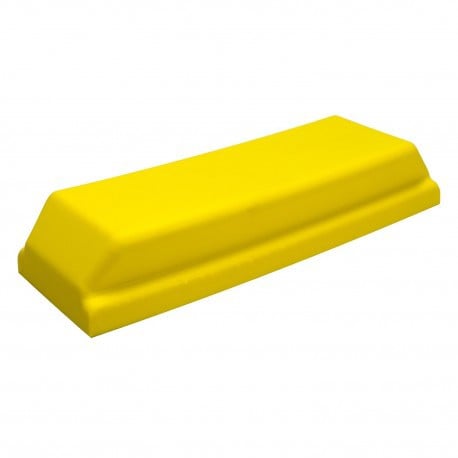 Yellow plastic block on a white background