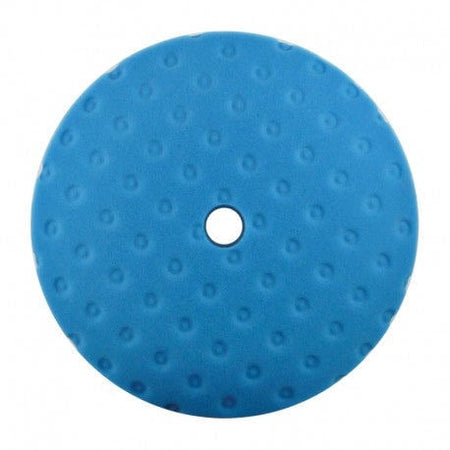 Blue polishing pad with a white center on a white background
