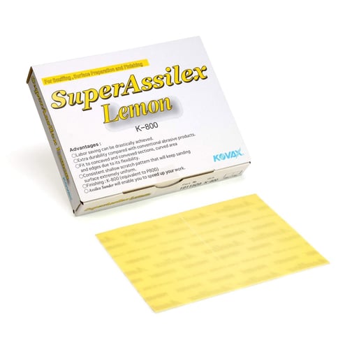 Box of SuperAssilex Lemon K-800 with a yellow abrasive sheet on a white background