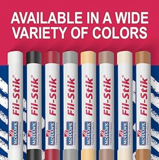 Fil-Stik markers in various colors with a red and blue striped background