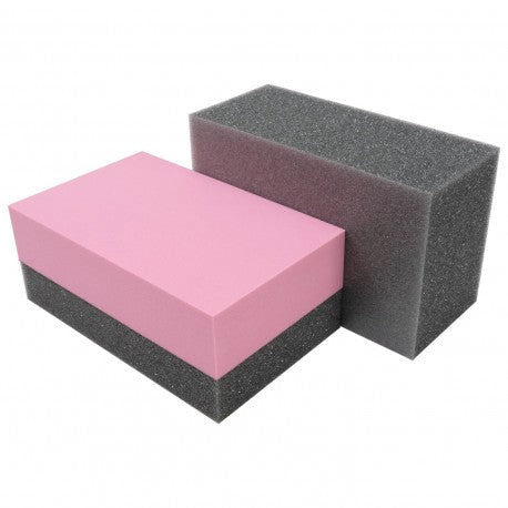 Two rectangular foam blocks, one pink and one gray, on a white background.