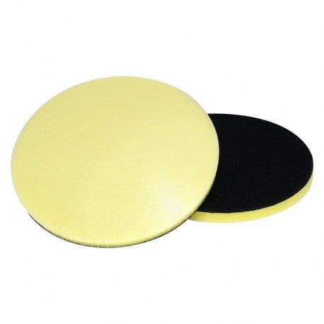 Two sanding discs, one yellow and one black, on a white background