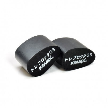Two black KOVAX treen blocks on a white background