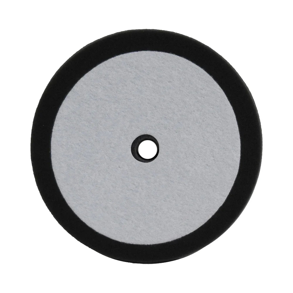 A 9-inch black foam buffing/polishing pad with a hole in the center for attachment.