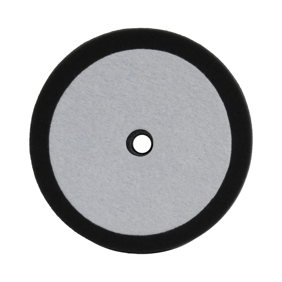 A 9-inch black foam buffing/polishing pad with a hole in the center for attachment.