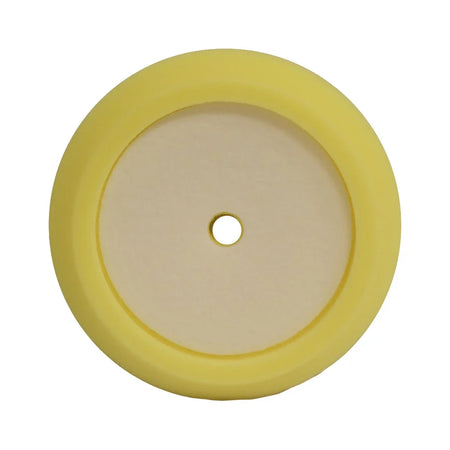 A circular yellow foam pad with a medium-cut design, used for polishing and buffing vehicle surfaces.