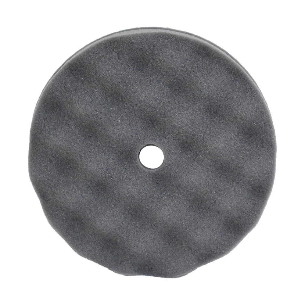 A single black velcro waffle pad with a hole in the center for attachment.