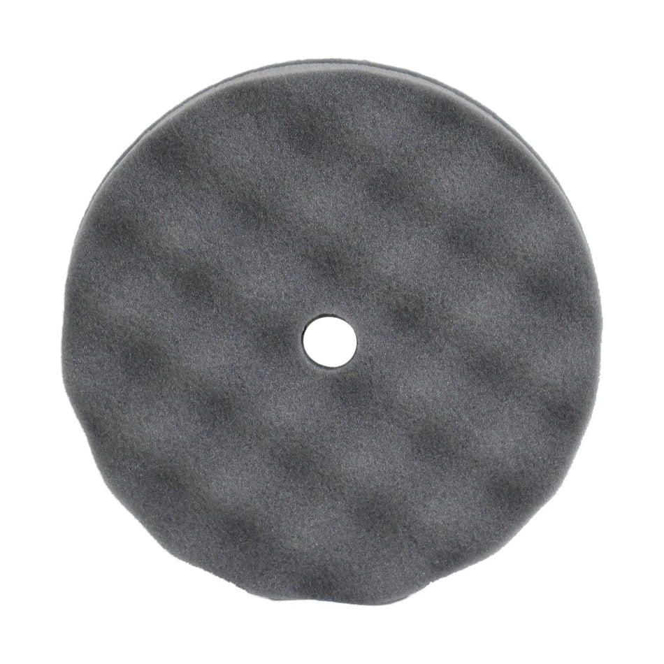 A single black velcro waffle pad with a hole in the center for attachment.