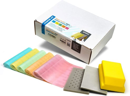 Set of colorful sanding sheets and a box on a white background